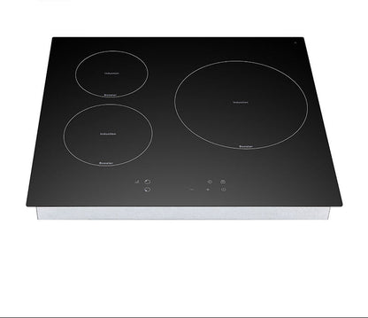 Black induction cooktop with four heating elements on a white background
